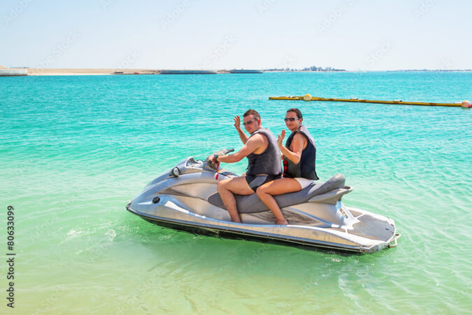 Couple on the jetski at the beach of Abu Dhabi, UAE